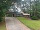 Two story home with a covered driveway at 4902 Pine Hill E Ct, Stone Mountain, GA 30088