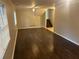 Spacious living room with hardwood floors, staircase and a ceiling fan at 4902 Pine Hill E Ct, Stone Mountain, GA 30088