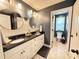 Modern bathroom featuring a double vanity, updated fixtures, and a separate toilet area at 8340 Nolandwood Ln, Villa Rica, GA 30180
