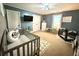 Calming Bedroom featuring two cribs, neutral decor, and plenty of space for baby essentials at 8340 Nolandwood Ln, Villa Rica, GA 30180