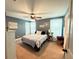 Charming bedroom with a comfortable bed, ceiling fan, and natural light from the windows at 8340 Nolandwood Ln, Villa Rica, GA 30180