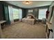 Cozy bedroom featuring a daybed, plush carpeting, and soft natural light, creating a welcoming and comfortable space at 8340 Nolandwood Ln, Villa Rica, GA 30180