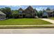 Traditional two-story home with a well-kept lawn, offering classic curb appeal in a friendly neighborhood setting at 8340 Nolandwood Ln, Villa Rica, GA 30180