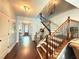 Bright foyer with hardwood floors and staircase at 8340 Nolandwood Ln, Villa Rica, GA 30180