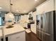 Spacious kitchen with stainless steel appliances, white cabinets and stone countertops at 8340 Nolandwood Ln, Villa Rica, GA 30180