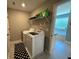 Laundry room with washer, dryer and shelving at 8340 Nolandwood Ln, Villa Rica, GA 30180