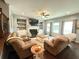 Cozy living room with a fireplace, built-in shelves, and hardwood floors at 8340 Nolandwood Ln, Villa Rica, GA 30180