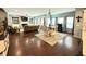 Open concept living room featuring fireplace, TV, and dining area with large windows at 8340 Nolandwood Ln, Villa Rica, GA 30180