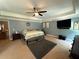 Serene primary bedroom with tray ceiling, neutral walls, cozy carpet, and modern furnishings, creating a peaceful retreat at 8340 Nolandwood Ln, Villa Rica, GA 30180