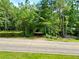 View of a wooded lot from the road at 8872 Conners Rd, Villa Rica, GA 30180