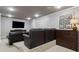 Finished basement with a wall mounted TV, tiered seating, recessed lighting, and crown molding at 1408 Chloe Dr, Lawrenceville, GA 30043