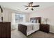 Bedroom with ceiling fan, a window with blinds, and hardwood furniture at 1408 Chloe Dr, Lawrenceville, GA 30043