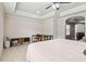 Bedroom with tray ceilings, ceiling fan, tile floors and access to office space at 1408 Chloe Dr, Lawrenceville, GA 30043