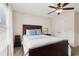 Cozy bedroom featuring a ceiling fan, carpeted floor, and comfortable queen bed at 1408 Chloe Dr, Lawrenceville, GA 30043