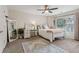 Inviting bedroom with a desk, mirror, and a large patterned rug at 1408 Chloe Dr, Lawrenceville, GA 30043