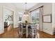 Bright dining area with modern table, chairs, and view into living room and backyard at 1408 Chloe Dr, Lawrenceville, GA 30043