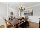 Dining area featuring an oversized wood dining table and chandelier at 1408 Chloe Dr, Lawrenceville, GA 30043