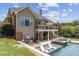 An exterior view reveals a large two-story home with a gorgeous backyard pool at 1408 Chloe Dr, Lawrenceville, GA 30043