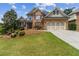 Charming brick two-story home with manicured lawn and beautiful landscaping at 1408 Chloe Dr, Lawrenceville, GA 30043