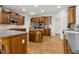 Spacious kitchen features wood cabinets, stainless steel appliances, and a center island at 1408 Chloe Dr, Lawrenceville, GA 30043