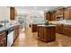 Gourmet kitchen with custom cabinetry, granite countertops, and a central island at 1408 Chloe Dr, Lawrenceville, GA 30043