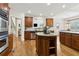 Spacious kitchen featuring stainless steel appliances, hardwood floors, and large island at 1408 Chloe Dr, Lawrenceville, GA 30043