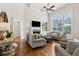 Bright living room featuring hardwood floors, large windows, and a vaulted ceiling at 1408 Chloe Dr, Lawrenceville, GA 30043