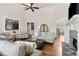 Spacious living room featuring hardwood floors, stone fireplace, and ample natural light at 1408 Chloe Dr, Lawrenceville, GA 30043