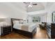 Spacious main bedroom with tray ceiling, sitting area, large windows, and dark wood trim at 1408 Chloe Dr, Lawrenceville, GA 30043