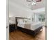 Main bedroom boasts a tray ceiling, large windows, and an ensuite bathroom at 1408 Chloe Dr, Lawrenceville, GA 30043