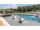 A backyard pool with sun loungers and a spa area creates a relaxing outdoor oasis at 1408 Chloe Dr, Lawrenceville, GA 30043