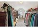 Spacious walk-in closet with built-in shelving for ample clothing and storage at 1408 Chloe Dr, Lawrenceville, GA 30043