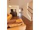 Spacious living room with comfortable seating and seamless transition to dining area at 4438 Lassen Ct, Suwanee, GA 30024