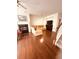 Cozy living room with fireplace, plush seating, and open staircase access at 4438 Lassen Ct, Suwanee, GA 30024