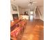 Open-concept living space with hardwood floors, fireplace, and ample natural light at 4438 Lassen Ct, Suwanee, GA 30024