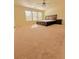 Spacious primary bedroom with ample natural light, a ceiling fan, and carpeted floors at 4438 Lassen Ct, Suwanee, GA 30024