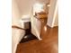 Staircase leads to living room with comfortable seating and a cozy fireplace at 4438 Lassen Ct, Suwanee, GA 30024