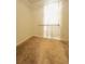 Walk-in closet with ample shelving for organized storage space and carpeted floors at 4438 Lassen Ct, Suwanee, GA 30024