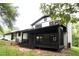 Backyard with covered porch, perfect for relaxing and entertaining guests at 69 N Hearn Rd, Ellenwood, GA 30294