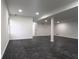 Bright basement featuring dark, marble-look floors and natural light at 69 N Hearn Rd, Ellenwood, GA 30294
