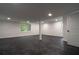 Spacious basement with dark, marble-look flooring and natural light at 69 N Hearn Rd, Ellenwood, GA 30294