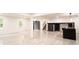 Spacious basement with modern tile flooring and ample natural light, perfect for versatile use at 69 N Hearn Rd, Ellenwood, GA 30294