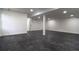 Open basement featuring dark, marble-look floors and natural light at 69 N Hearn Rd, Ellenwood, GA 30294