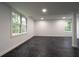 Finished basement featuring large windows and dark flooring at 69 N Hearn Rd, Ellenwood, GA 30294