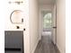 Well-lit bathroom with stylish vanity and gray wood-look floors at 69 N Hearn Rd, Ellenwood, GA 30294