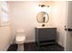 Bathroom with a modern vanity and black tile flooring at 69 N Hearn Rd, Ellenwood, GA 30294