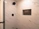 Modern shower with marble tile and black fixtures offers a luxurious washing experience at 69 N Hearn Rd, Ellenwood, GA 30294