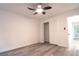 Bright bedroom with wood-look floors, ceiling fan, and closet at 69 N Hearn Rd, Ellenwood, GA 30294