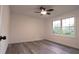 Bedroom featuring large window and modern ceiling fan for added comfort at 69 N Hearn Rd, Ellenwood, GA 30294