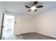 Bedroom featuring modern ceiling fan, hardwood floors, and closet at 69 N Hearn Rd, Ellenwood, GA 30294